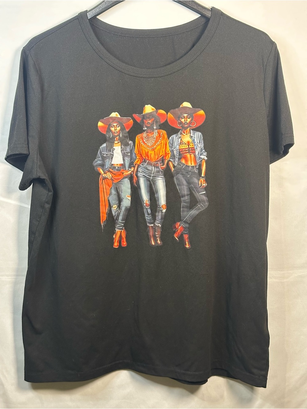 Women’s Black Cowgirls Graphic Tee with Orange Accent Design